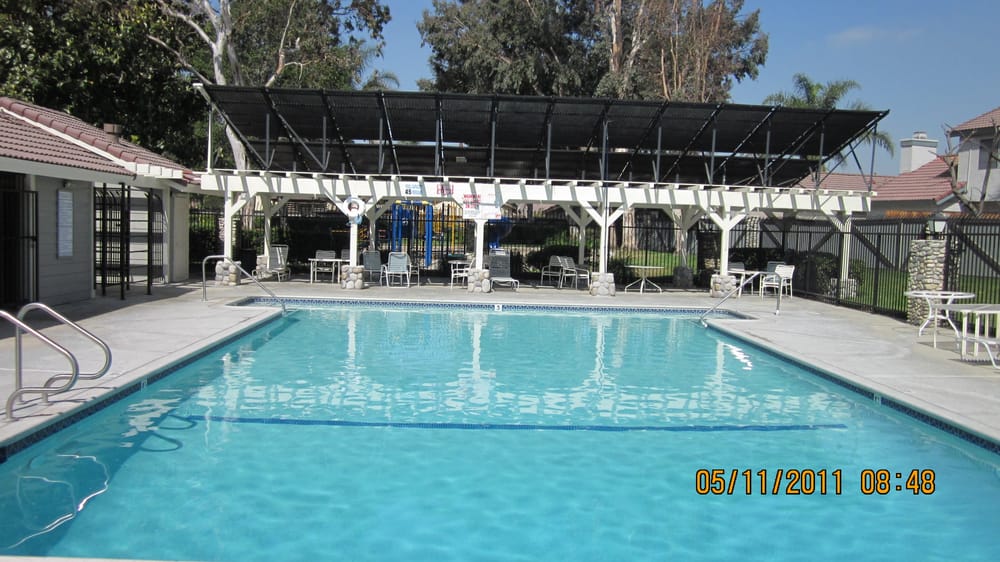 A commercial pool with an overhead solar collector canopy