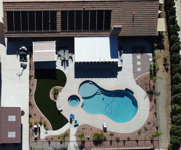 Solar mats on a SoCal roof above a backyard pool